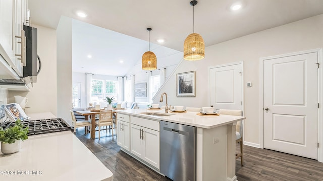 10 Victoria Gardens Sq, Neptune Township, NJ 07753 - kitchen featuring appliances with stainless steel finishes, dark wood-style floors, white cabinets, light countertops, and decorative light fixtures