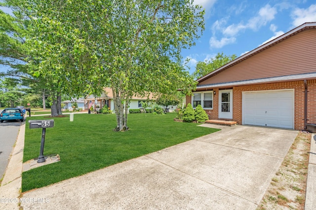 65 Sycamore Rd, Manahawkin, NJ 08050 - view of front of house featuring brick siding, a front lawn, and driveway