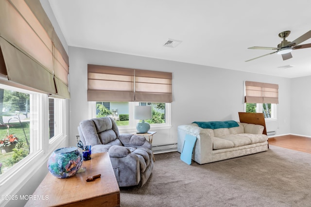 65 Sycamore Rd, Manahawkin, NJ 08050 - living room with baseboard heating, a baseboard radiator, a ceiling fan, and carpet