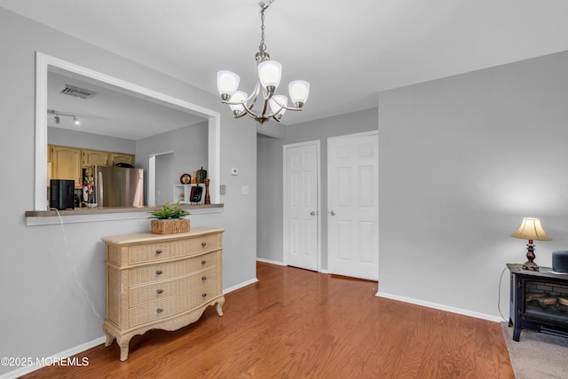 65 Sycamore Rd, Manahawkin, NJ 08050 - interior space with a chandelier and wood finished floors