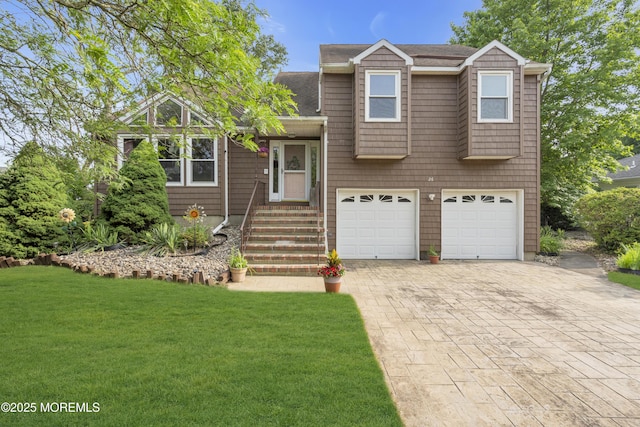 26 Shasta Ln, Toms River, NJ 08753 - tri-level home featuring an attached garage, decorative driveway, a front yard, and a shingled roof