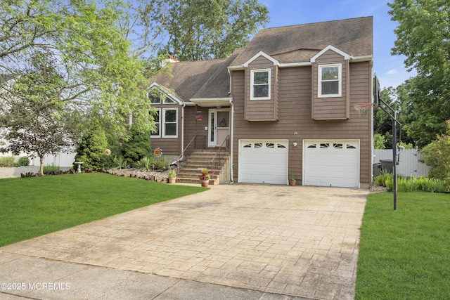 26 Shasta Ln, Toms River, NJ 08753 - tri-level home featuring driveway, an attached garage, and roof with shingles
