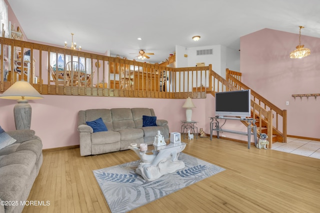 26 Shasta Ln, Toms River, NJ 08753 - living room featuring a chandelier, hardwood / wood-style floors, stairs, a ceiling fan, and recessed lighting