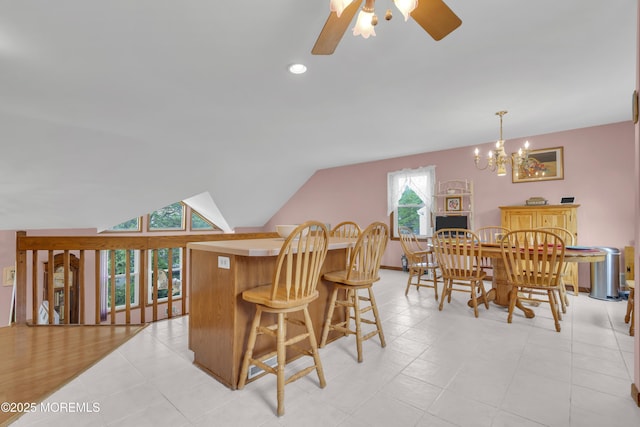 26 Shasta Ln, Toms River, NJ 08753 - kitchen featuring ceiling fan, a breakfast bar area, a chandelier, lofted ceiling, and light tile patterned flooring