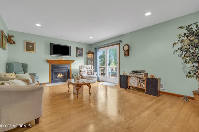 26 Shasta Ln, Toms River, NJ 08753 - living room with a warm lit fireplace, wood finished floors, and recessed lighting