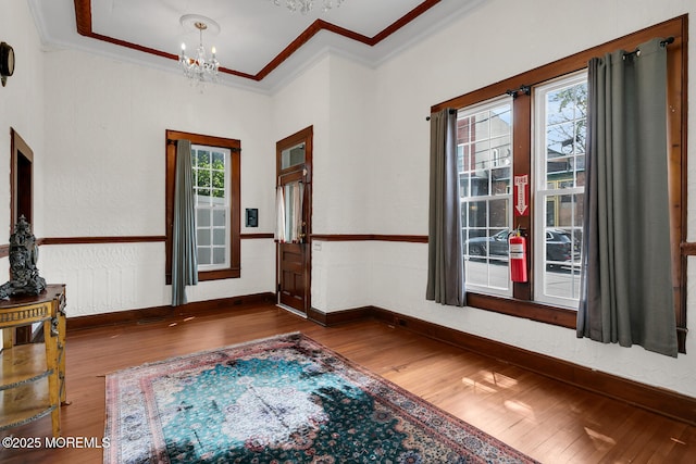 55 E Front St, Keyport, NJ 07735 - foyer with crown molding, wood finished floors, plenty of natural light, and a chandelier