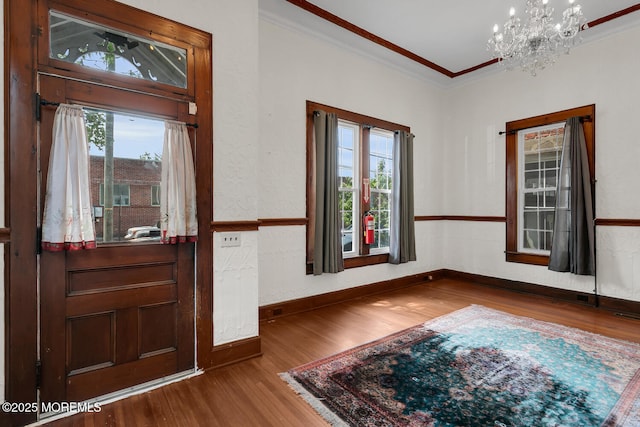 55 E Front St, Keyport, NJ 07735 - foyer with plenty of natural light, wood finished floors, ornamental molding, and a chandelier