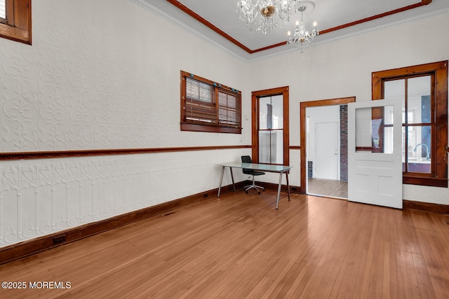 55 E Front St, Keyport, NJ 07735 - spare room with a chandelier, wood finished floors, and ornamental molding