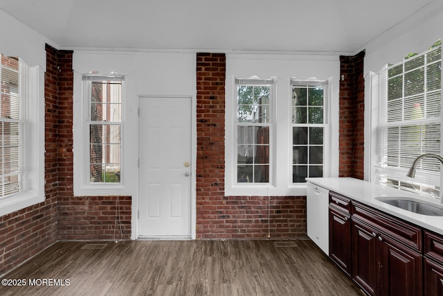 55 E Front St, Keyport, NJ 07735 - kitchen with brick wall, wood finished floors, light countertops, and plenty of natural light