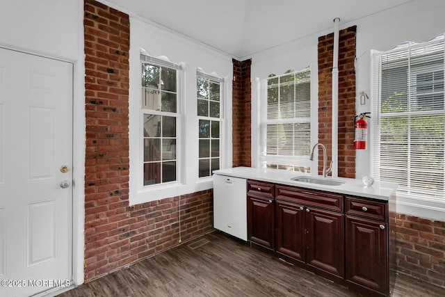 55 E Front St, Keyport, NJ 07735 - interior space featuring dishwasher, brick wall, dark wood-style flooring, light countertops, and healthy amount of natural light