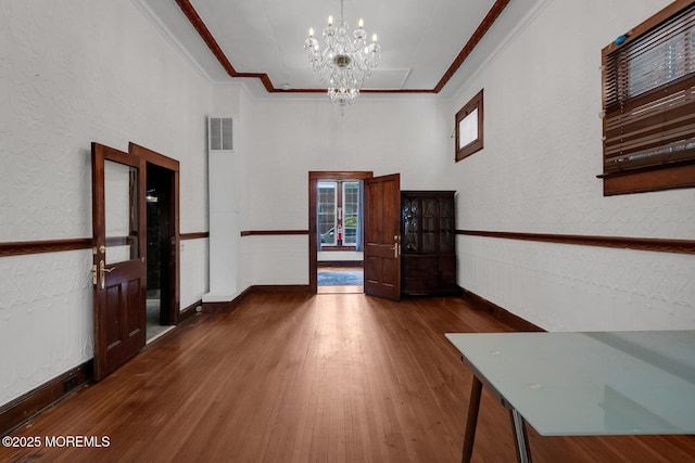 55 E Front St, Keyport, NJ 07735 - entryway featuring a chandelier, wood finished floors, ornamental molding, and wainscoting