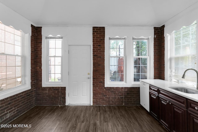 55 E Front St, Keyport, NJ 07735 - kitchen with brick wall, dishwasher, dark wood-style flooring, and light countertops