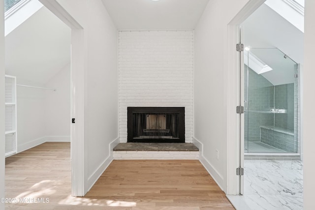 24 Tuers Pl, Upper Montclair, NJ 07043 - detailed view of a brick fireplace, wood finished floors, and a skylight