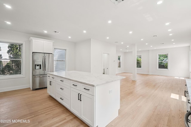 24 Tuers Pl, Upper Montclair, NJ 07043 - kitchen featuring stainless steel fridge, a center island, light wood-style floors, white cabinets, and recessed lighting