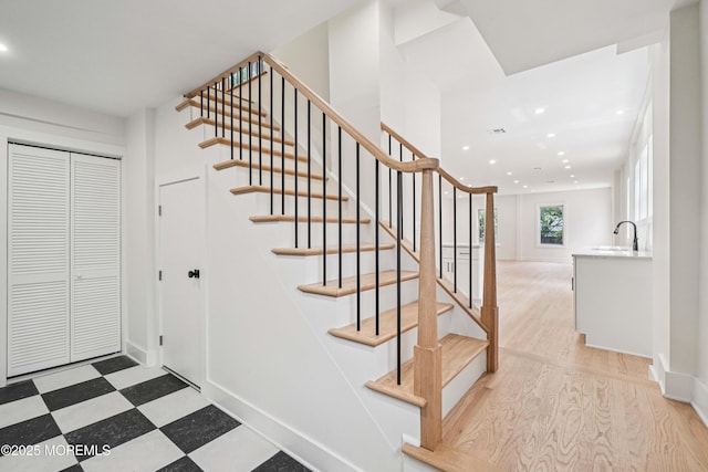 24 Tuers Pl, Upper Montclair, NJ 07043 - stairs with recessed lighting and tile patterned floors