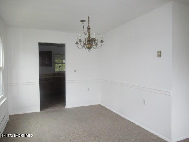 10 Dunstable Rd, Vincentown, NJ 08088 - unfurnished dining area with a chandelier and carpet