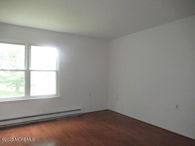 10 Dunstable Rd, Vincentown, NJ 08088 - unfurnished room featuring a baseboard radiator and wood finished floors