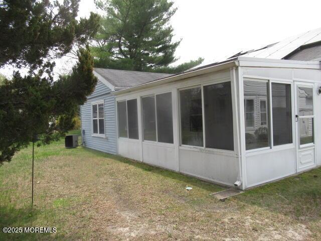 10 Dunstable Rd, Vincentown, NJ 08088 - view of property exterior with a sunroom