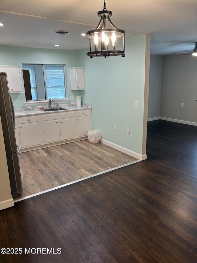2211 Yorktowne Blvd, Toms River, NJ 08753 - kitchen with freestanding refrigerator, white cabinets, dark wood-style flooring, and recessed lighting