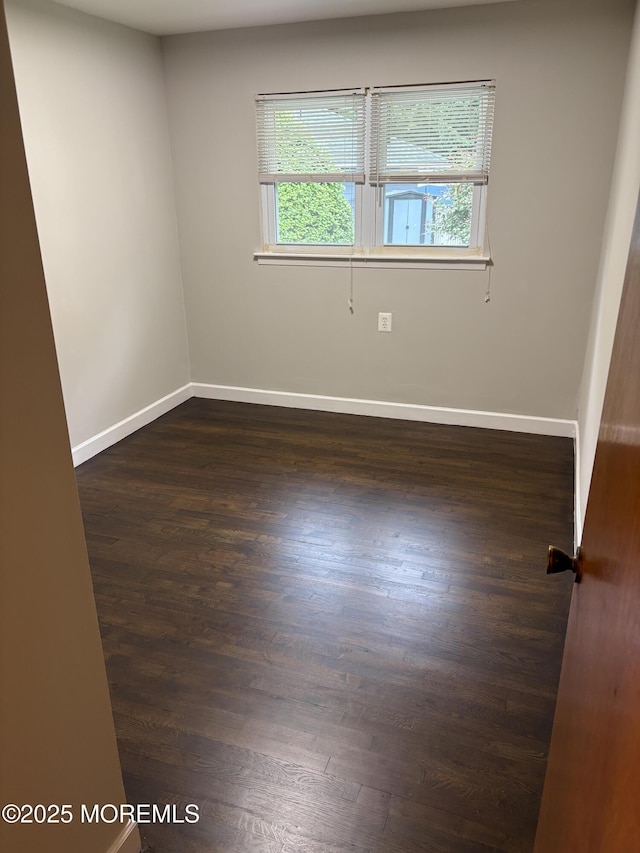 2211 Yorktowne Blvd, Toms River, NJ 08753 - empty room featuring dark wood-style floors and baseboards