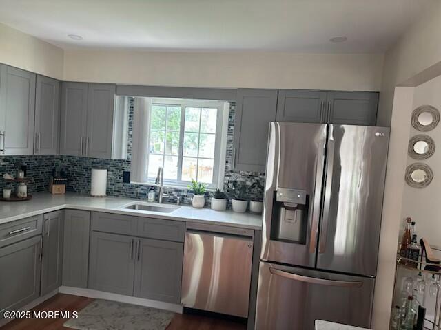 11 Bristlecone Dr, Howell, NJ 07731 - kitchen with appliances with stainless steel finishes, gray cabinetry, tasteful backsplash, and light countertops
