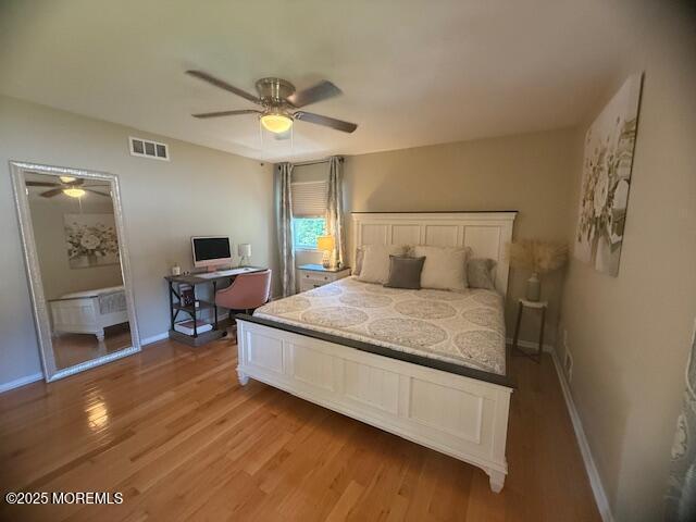 11 Bristlecone Dr, Howell, NJ 07731 - bedroom with light wood-style flooring and a ceiling fan
