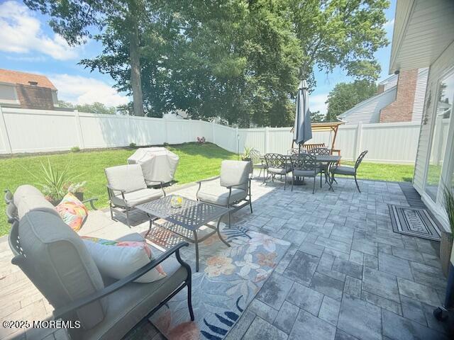 11 Bristlecone Dr, Howell, NJ 07731 - fenced backyard with an outdoor living space, outdoor dining area, and a patio area
