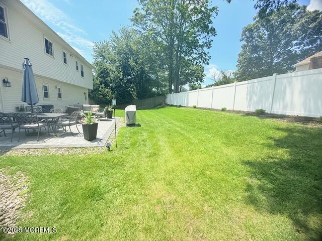 11 Bristlecone Dr, Howell, NJ 07731 - fenced backyard featuring a patio area