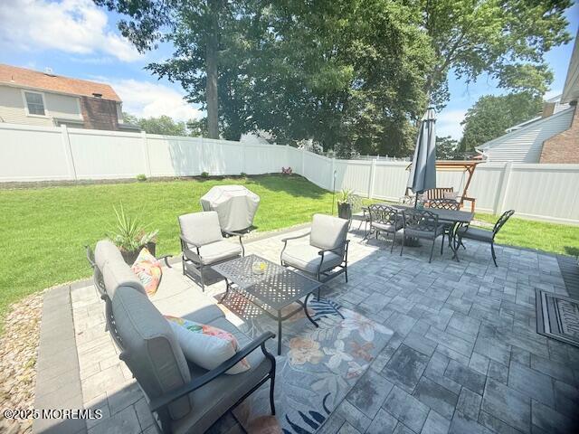 11 Bristlecone Dr, Howell, NJ 07731 - fenced backyard with an outdoor living space, outdoor dining area, a patio, and grilling area