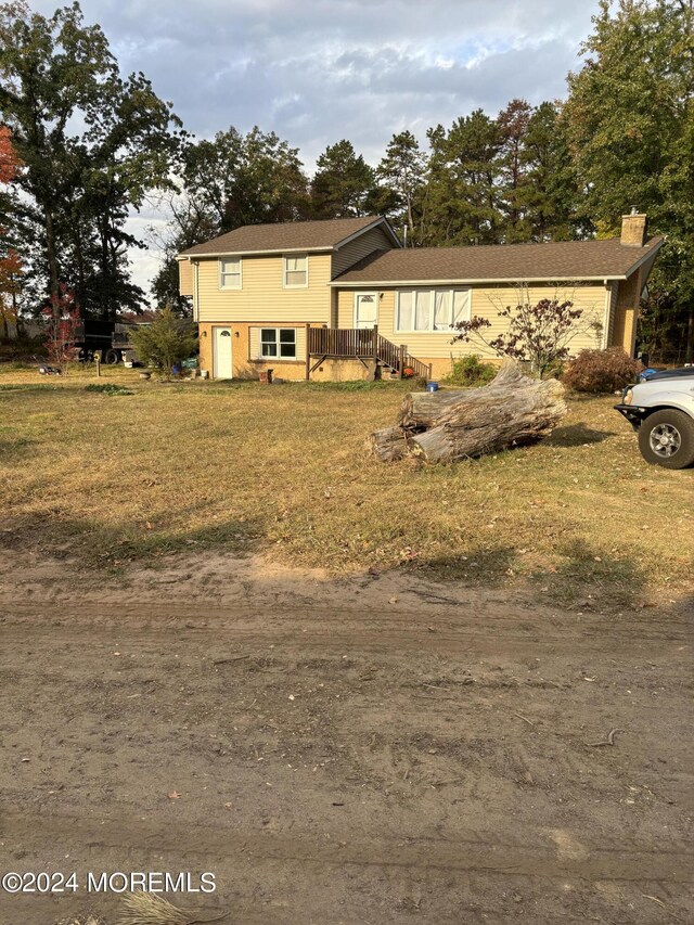 825 Rte 539, Plumsted, NJ 08533 - split level home with a front lawn and a chimney