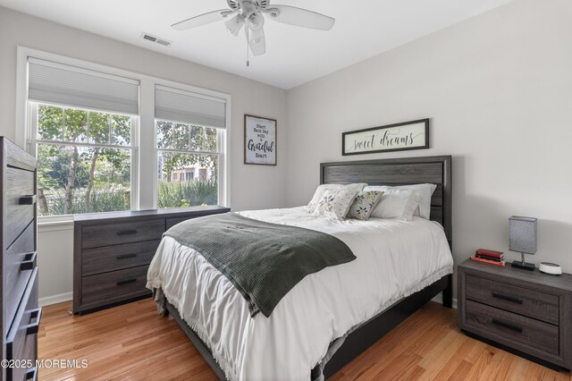 22 Cooper Ave Unit 113, Long Branch, NJ 07740 - bedroom with light wood-style floors and ceiling fan