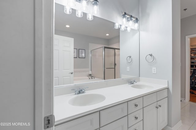 22 Cooper Ave Unit 113, Long Branch, NJ 07740 - full bath with a shower stall, a spacious closet, double vanity, tile patterned floors, and a bath
