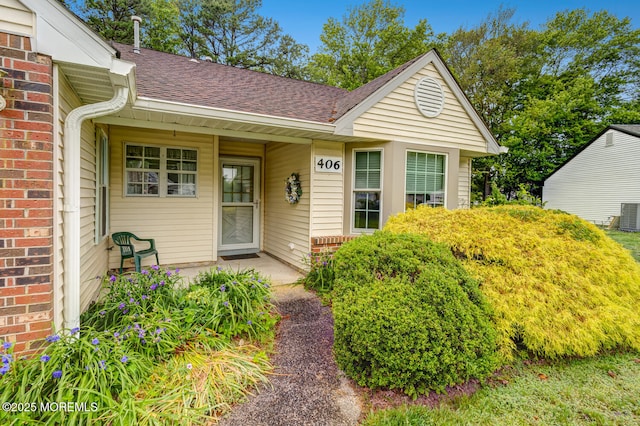 406 Betsy Ross Ln, Little Egg Harbor, NJ 08087 - property entrance with roof with shingles and brick siding