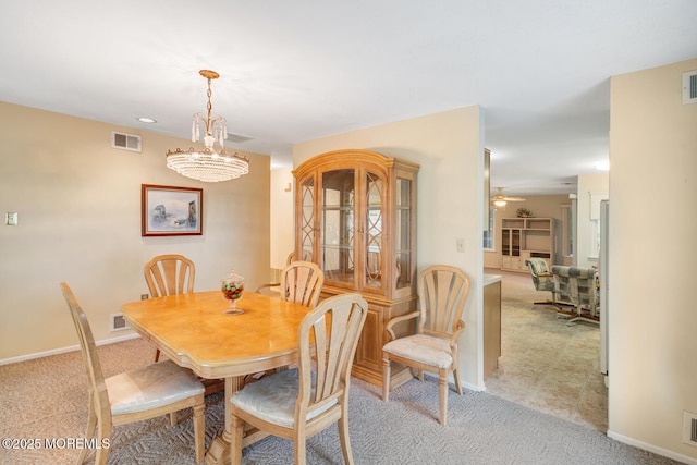 406 Betsy Ross Ln, Little Egg Harbor, NJ 08087 - dining area with light colored carpet and a chandelier