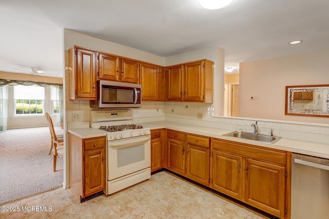406 Betsy Ross Ln, Little Egg Harbor, NJ 08087 - kitchen with appliances with stainless steel finishes, light countertops, brown cabinets, tasteful backsplash, and recessed lighting