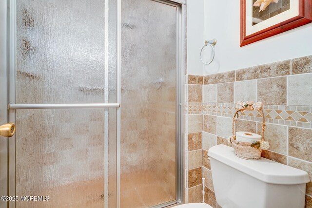 406 Betsy Ross Ln, Little Egg Harbor, NJ 08087 - bathroom featuring a stall shower and tile walls