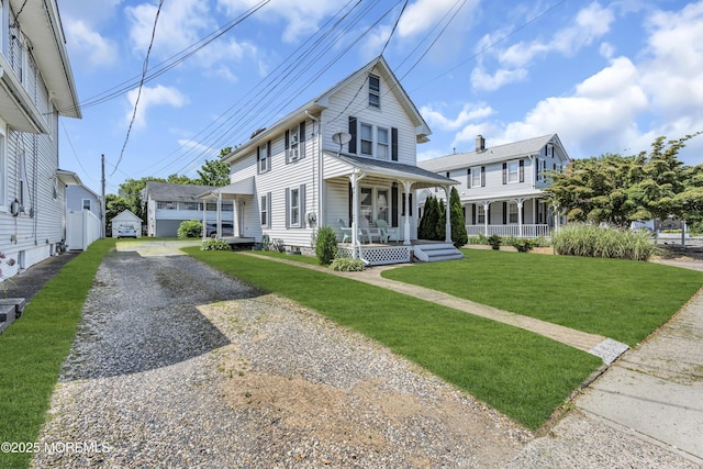 59591/2 Taylor Ave, Manasquan, NJ 08736 - view of front of home featuring covered porch, driveway, and a front yard