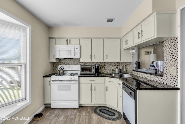 59591/2 Taylor Ave, Manasquan, NJ 08736 - kitchen featuring white appliances, light wood-type flooring, tasteful backsplash, and white cabinets