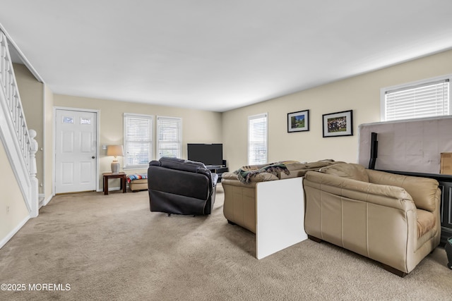 59591/2 Taylor Ave, Manasquan, NJ 08736 - living room featuring light carpet, stairway, and plenty of natural light