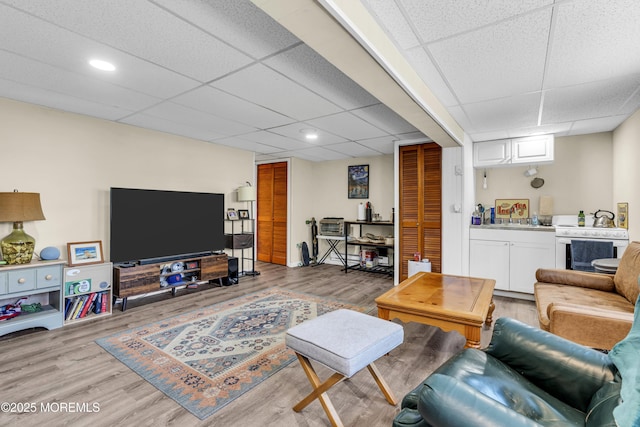 59591/2 Taylor Ave, Manasquan, NJ 08736 - living area featuring a paneled ceiling and light wood-style flooring
