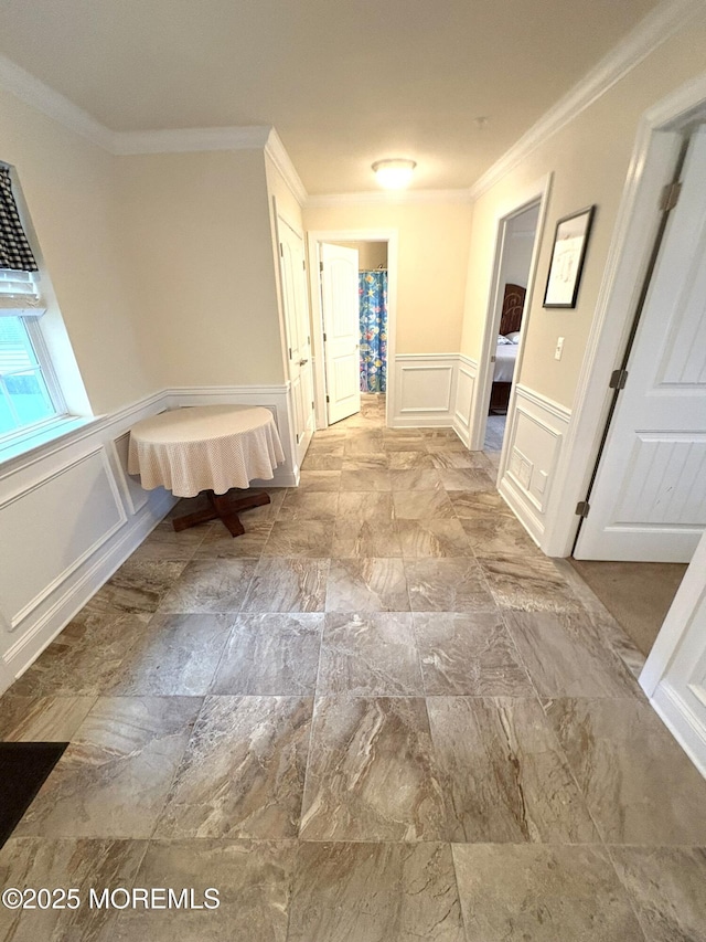 119 Dupont Ave Unit 10, Seaside Heights, NJ 08751 - hallway featuring a decorative wall, a wainscoted wall, and crown molding