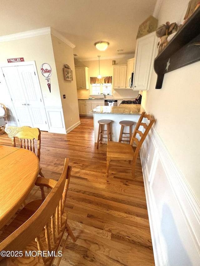 119 Dupont Ave Unit 10, Seaside Heights, NJ 08751 - dining room with ornamental molding and wood finished floors