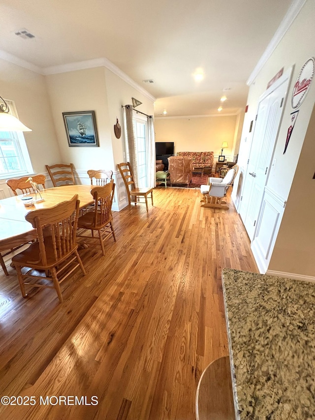 119 Dupont Ave Unit 10, Seaside Heights, NJ 08751 - dining space featuring light wood-type flooring and crown molding