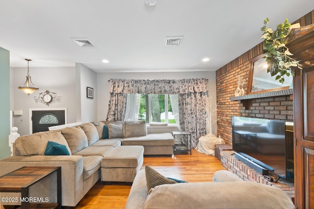 5 Poplar St, Jackson, NJ 08527 - living room featuring light wood-style flooring, a brick fireplace, and recessed lighting
