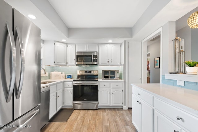 5 Poplar St, Jackson, NJ 08527 - kitchen featuring appliances with stainless steel finishes, light countertops, white cabinets, and recessed lighting