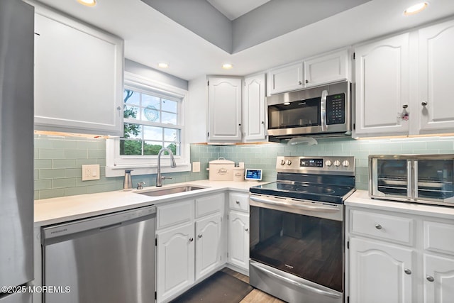 5 Poplar St, Jackson, NJ 08527 - kitchen with appliances with stainless steel finishes, white cabinetry, backsplash, and recessed lighting