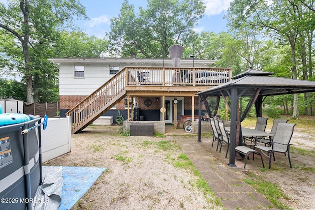 5 Poplar St, Jackson, NJ 08527 - rear view of property featuring stairs, a deck, a patio, brick siding, and a gazebo