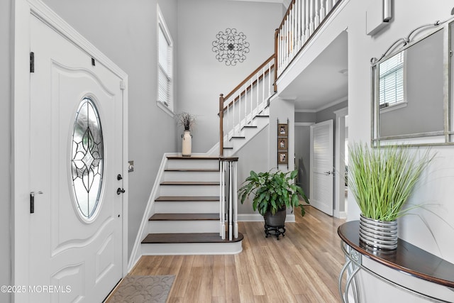 36 Sally St, Howell, NJ 07731 - entryway with light wood-style flooring, stairway, and a high ceiling