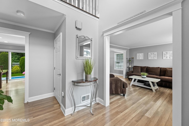 36 Sally St, Howell, NJ 07731 - hallway with crown molding and light wood-style flooring