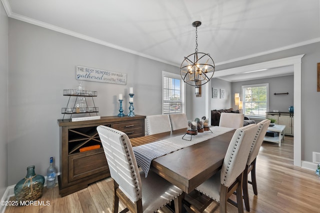 36 Sally St, Howell, NJ 07731 - dining area featuring a chandelier, light wood-style flooring, and ornamental molding